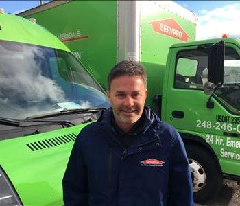 Male Owner standing in front of one of our SERVPRO trucks In the driveway in front of our garage in Ferndale Mi. 