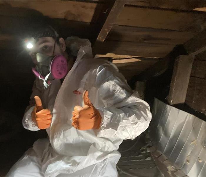 Mask, protective clothing, gloves, thumbs up.
